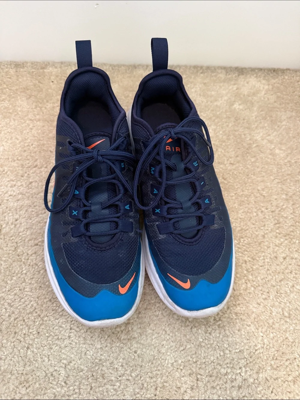 Boys size 4.5 Nike air Navy and Blue Sneakers with Orange Swoosh